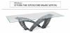Tavolo design Cattelan Histrix con piano in cristallo trasparente da 15 mm, base in acciaio verniciato trasparente e piastre goffrate graphite, ideale per sale riunioni direzionali e ambienti professionali di rappresentanza.