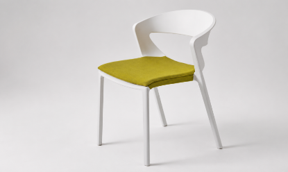 Sedia fissa monoblocco impilabile per ufficio, sale riunioni e ambienti contract, realizzata in polipropilene rinforzato con fibra vetro stampato a iniezione, disponibile in diversi colori e proposta con cuscino in tessuto per maggiore comfort.